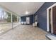 Covered porch with tiled flooring, white railings, and inviting wicker chairs at entrance at 12507 N Roxboro St, Rougemont, NC 27572