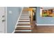 Staircase with wood treads and white risers leads to the upper level of the home at 12507 N Roxboro St, Rougemont, NC 27572