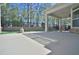 View of the covered patio with a stone accent and outdoor seating, perfect for relaxing and entertaining at 1305 Betasso Dr, Cary, NC 27519