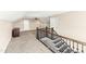 Finished attic with hardwood stairs, railing, neutral carpet, and built in shelving at 158 Futrell Ridge Ct, Chapel Hill, NC 27517