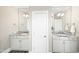 This bathroom features double sinks with granite countertops, framed mirrors, and wood-look flooring at 158 Futrell Ridge Ct, Chapel Hill, NC 27517