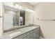 Bathroom featuring a double vanity with granite countertop and decorative light fixtures at 158 Futrell Ridge Ct, Chapel Hill, NC 27517