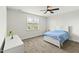 Bright bedroom with a white bed, neutral carpet, and large window with natural light at 158 Futrell Ridge Ct, Chapel Hill, NC 27517