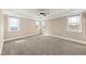 This bedroom features neutral paint colors and large windows that provide an abundance of natural light at 158 Futrell Ridge Ct, Chapel Hill, NC 27517