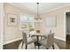 Charming dining room with a stylish chandelier and natural light at 158 Futrell Ridge Ct, Chapel Hill, NC 27517