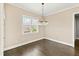 Well-lit dining room with hardwood floors and elegant trim at 158 Futrell Ridge Ct, Chapel Hill, NC 27517