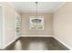 Bright dining room with a chandelier, adjacent to an outdoor patio at 158 Futrell Ridge Ct, Chapel Hill, NC 27517
