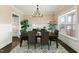 Formal dining room with dark wood table, seating for six, and a decorative chandelier at 158 Futrell Ridge Ct, Chapel Hill, NC 27517