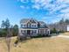 Charming two-story home with a manicured lawn, stone accents, and a welcoming front porch at 158 Futrell Ridge Ct, Chapel Hill, NC 27517