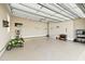 Spacious garage featuring an epoxy floor, ample storage and workout equipment at 158 Futrell Ridge Ct, Chapel Hill, NC 27517