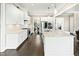 Spacious white kitchen with granite island, stainless steel appliances, and open layout to dining room at 158 Futrell Ridge Ct, Chapel Hill, NC 27517