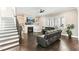 Bright living room boasting a fireplace, large windows, and cozy seating at 158 Futrell Ridge Ct, Chapel Hill, NC 27517