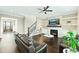 Inviting living room featuring a fireplace, coffered ceiling, and elegant hardwood floors at 158 Futrell Ridge Ct, Chapel Hill, NC 27517