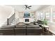 Cozy living room with a fireplace, large TV, and comfortable leather seating at 158 Futrell Ridge Ct, Chapel Hill, NC 27517
