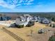 Traditional-style two-story home with a spacious manicured lawn and an elevated back porch at 158 Futrell Ridge Ct, Chapel Hill, NC 27517