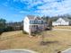 Traditional-style two-story home with manicured lawn, wrought iron fence, and mature trees at 158 Futrell Ridge Ct, Chapel Hill, NC 27517