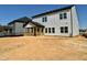 A spacious backyard with a covered wooden porch enhances the appeal of this home's exterior and outdoor living space at 167 S Harvest Ridge Way # Homesite 223, Wilson's Mills, NC 27520