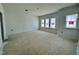 A view of an unfinished bedroom featuring several windows that provide lots of natural light at 167 S Harvest Ridge Way # Homesite 223, Wilson's Mills, NC 27520