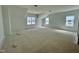 A view of an unfinished bedroom featuring three windows that offer plenty of natural light at 167 S Harvest Ridge Way # Homesite 223, Wilson's Mills, NC 27520