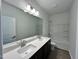 Bright bathroom featuring a double vanity with a large mirror and a shower-tub combination at 167 S Harvest Ridge Way # Homesite 223, Wilson's Mills, NC 27520