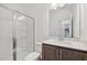 Clean bathroom with glass-enclosed shower, modern fixtures, and granite vanity at 167 S Harvest Ridge Way # Homesite 223, Wilson's Mills, NC 27520