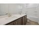 Bathroom featuring double sinks, modern fixtures, shower and tub combination, and plank flooring at 167 S Harvest Ridge Way # Homesite 223, Wilson's Mills, NC 27520