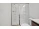 Bright bathroom with a glass shower door and white fixtures at 167 S Harvest Ridge Way # Homesite 223, Wilson's Mills, NC 27520