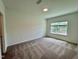 Clean, carpeted bedroom with a window offering natural light at 167 S Harvest Ridge Way # Homesite 223, Wilson's Mills, NC 27520