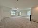 Spacious carpeted bonus room with multiple windows for ample natural light at 167 S Harvest Ridge Way # Homesite 223, Wilson's Mills, NC 27520