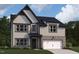 Charming home featuring brick accents and an attached garage with a classic exterior elevation at 167 S Harvest Ridge Way # Homesite 223, Wilson's Mills, NC 27520