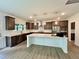 Modern kitchen with a white island, stainless steel appliances, and stylish dark cabinets at 167 S Harvest Ridge Way # Homesite 223, Wilson's Mills, NC 27520