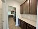 Gourmet kitchen featuring granite countertops, stainless steel appliances, and dark cabinetry at 167 S Harvest Ridge Way # Homesite 223, Wilson's Mills, NC 27520