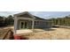 New construction home boasts covered patio in landscaped backyard at 178 Gobbler Dr, Smithfield, NC 27577