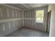 Bedroom featuring a bright window and bare concrete floors ready for finishing at 178 Gobbler Dr, Smithfield, NC 27577