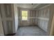 Bedroom featuring a bright window and bare concrete floors ready for finishing at 178 Gobbler Dr, Smithfield, NC 27577