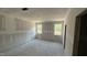 Bedroom featuring two bright windows and bare concrete floors ready for finishing at 178 Gobbler Dr, Smithfield, NC 27577