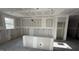 Kitchen area featuring multiple windows and bare concrete floors ready for finishing at 178 Gobbler Dr, Smithfield, NC 27577