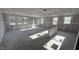 Spacious living room featuring abundant natural light with large windows and bare concrete floors at 178 Gobbler Dr, Smithfield, NC 27577