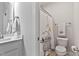 Charming bathroom with a toilet and shower featuring a fun Snoopy-themed shower curtain and decor at 1872 Stagecoach Trl, Wendell, NC 27591