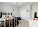 Cheerful bedroom with baseball-themed decor, including a unique baseball bat headboard and sporty accents at 1872 Stagecoach Trl, Wendell, NC 27591