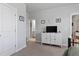 Well-organized bedroom with neutral walls, a double-door closet, and a view into an adjacent bathroom at 1872 Stagecoach Trl, Wendell, NC 27591