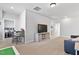 Versatile bonus room with neutral walls, plush carpeting, play area, and a large television at 1872 Stagecoach Trl, Wendell, NC 27591