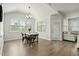Bright dining area with vaulted ceilings and large windows providing abundant natural light at 1872 Stagecoach Trl, Wendell, NC 27591