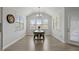 Bright dining room with vaulted ceiling, a rustic dining table, and a chandelier at 1872 Stagecoach Trl, Wendell, NC 27591