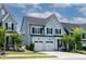 Beautiful two-story home featuring a two-car garage, neat landscaping, and a charming front porch at 1872 Stagecoach Trl, Wendell, NC 27591
