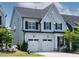 Charming two-story home featuring a two-car garage, neat landscaping, and classic architectural details at 1872 Stagecoach Trl, Wendell, NC 27591