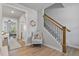 Hallway and staircase with carpeted steps and wooden railing at 1872 Stagecoach Trl, Wendell, NC 27591