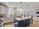 This spacious kitchen has a center island with seating and plenty of counter space for cooking at 1872 Stagecoach Trl, Wendell, NC 27591