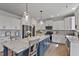 Well-lit kitchen with a large center island, great countertops, and stainless steel appliances at 1872 Stagecoach Trl, Wendell, NC 27591