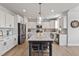 Modern kitchen features sleek appliances, plenty of counter space, and a stylish center island at 1872 Stagecoach Trl, Wendell, NC 27591